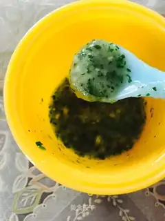 Baby eats green rice powder