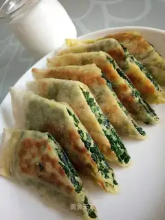 An egg roll with a pickle