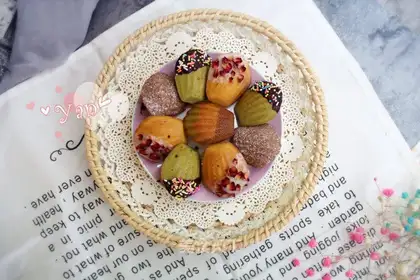 Orange-coloured Madeleine cake