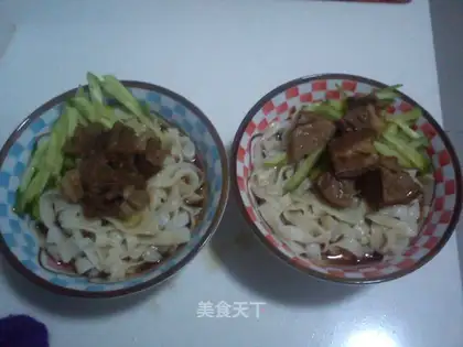 Braised beef brisket served with noodles