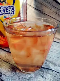 A glass of fruit and grass