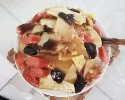 Potato-covered tomatoes