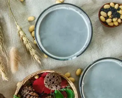 A glass of black soy
