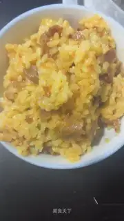 The lamb's hand grabs rice