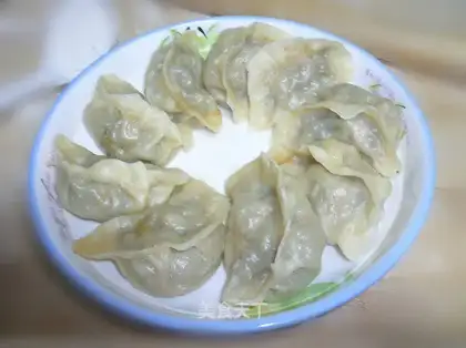 steamed dumplings stuffed with Chinese toon