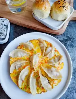 Vegetables holding eggs and dumplings
