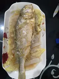 It's a big yellow fish doll