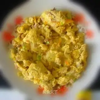 Fried eggs with fish sausage