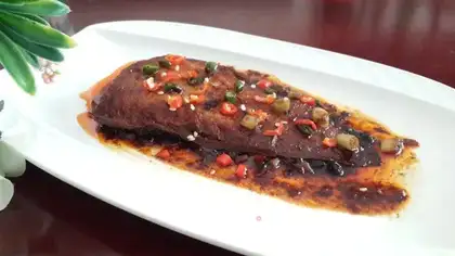 Godmother beef sauce and fish tails