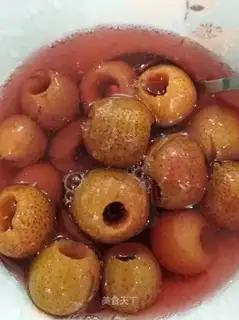 Homemade cans of red fruit