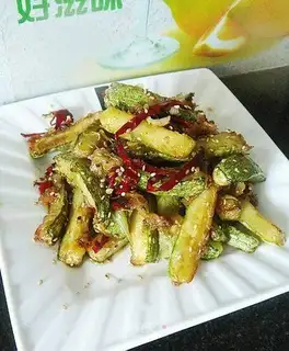 Dry stir-fried zucchini strips