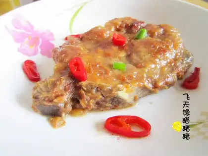 Grilled steak with green onions