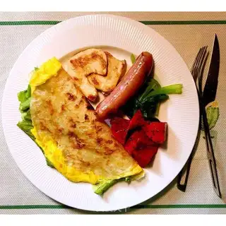 Hand-held chicken chest breakfast