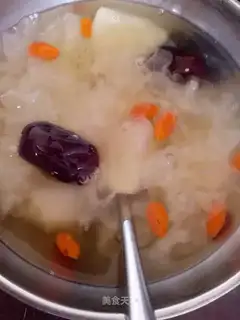 A silver spoon with dates