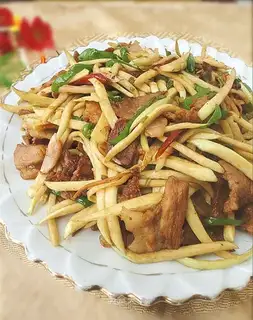 Stir fried pork slices with rice bamboo