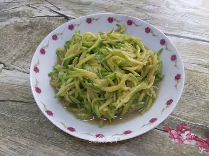 Cleaning up the green pumpkins