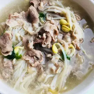 Golden mushrooms, bean sprouts, lamb soup