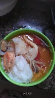Seafood, beef and tomato in rice