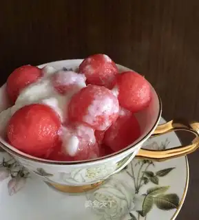 A watermelon ball with honey yogurt
