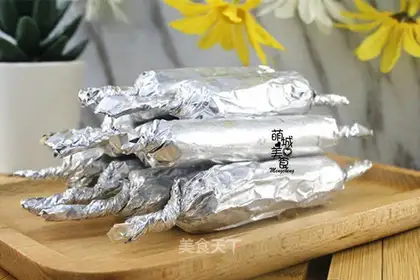 The baby eats a mountain sausage
