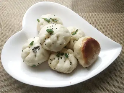 A meat bun with mushrooms