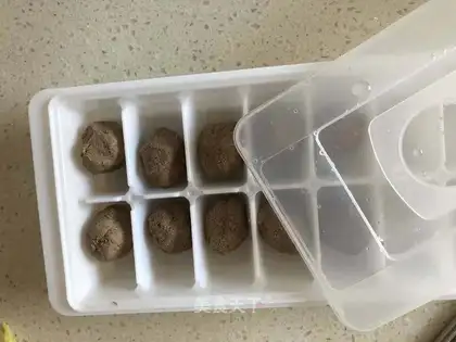 The baby eats chicken liver mud