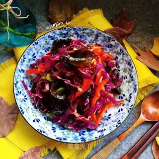 Blue and sweet peppers with wood