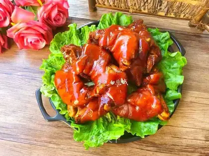 Hands on pig's feet