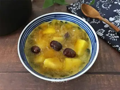 A silver spoon of apple date