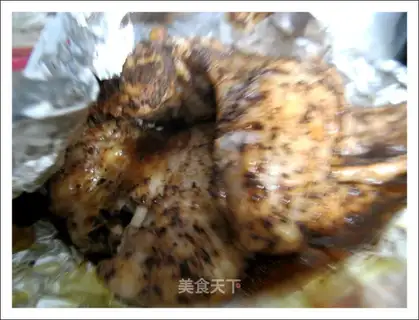 Roasted chicken wings with barbecue sauce and black tea