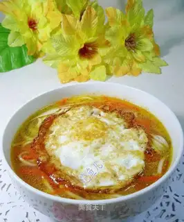 Fried eggs, carrots, noodles