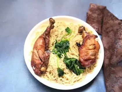 A spinach duck with noodles