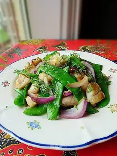 Fried fish fillets with lotus beans and onions