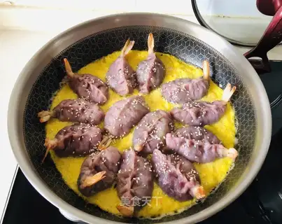 Eggs holding shrimp and blue dumplings