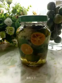 A green orange with honey