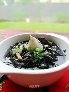 Fish wrapped with eggs with purple cabbage