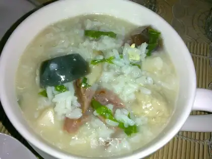 Sausage, preserved egg, fish ball porridge