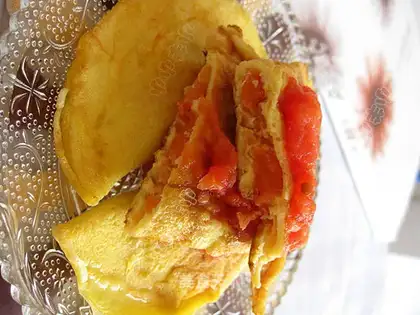 Tomatoes wrapped in eggs