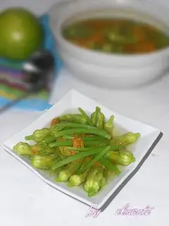 Soup with pumpkin flowers