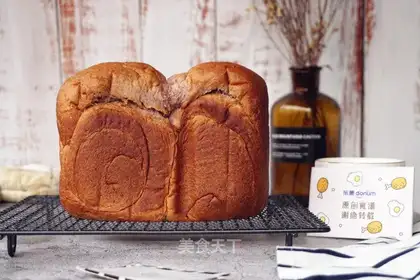 The baker's hand tore the bread