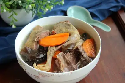Wood carrot pigeon soup