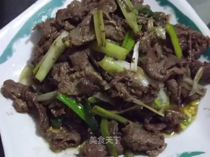 lamb with fried green onions