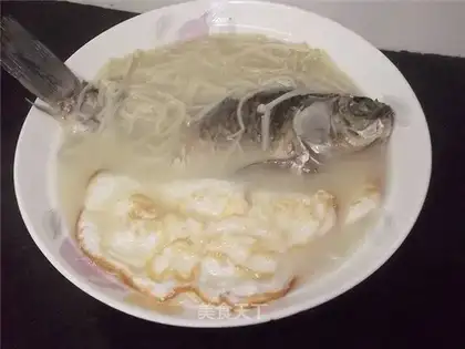 Carp soup with poached eggs