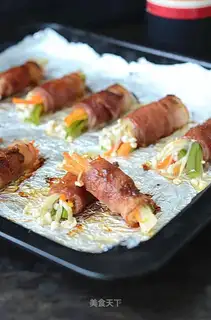 Bacon rolls with sand and tea