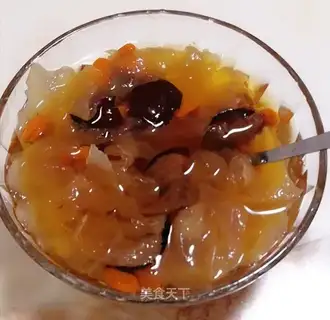 A silver spoon with red dates