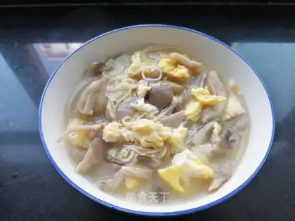 The hot soup, the mushroom egg soup. Noodles