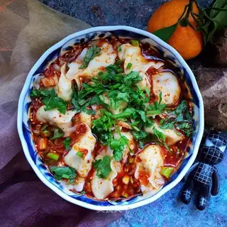 Red-oiled soup and lamb dumplings
