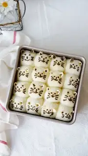 Ugly cat squeezing bread