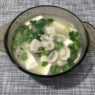 Spoon mushroom tofu soup