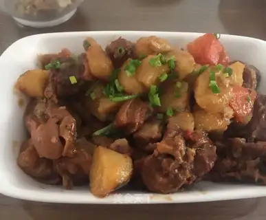 Red lamb steak and potatoes